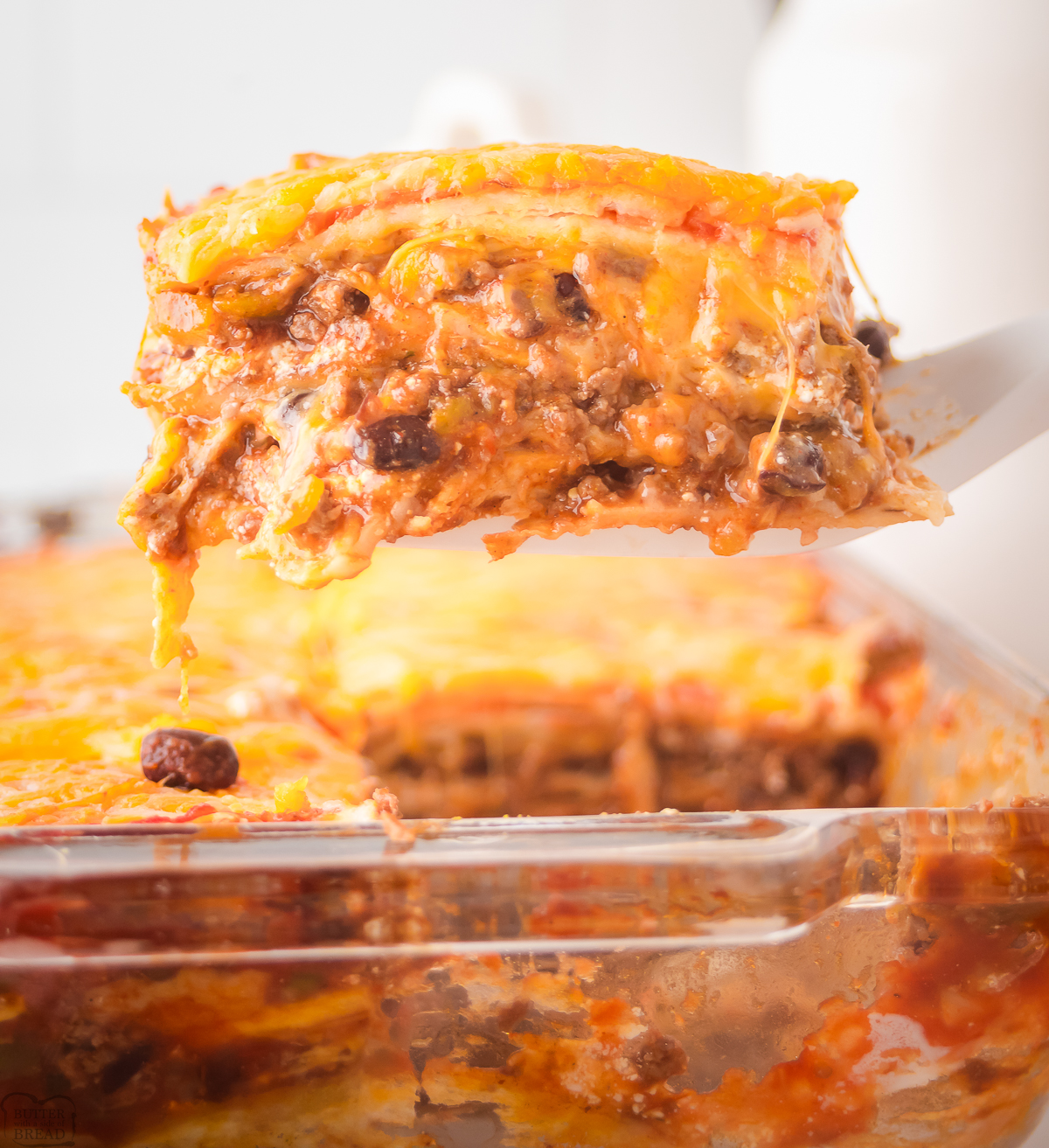serving up a piece of beef taco casserole