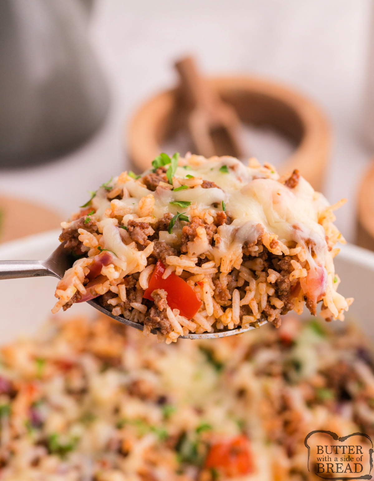 Spoonful of Unstuffed Pepper Skillet made with ground beef, cheese, rice, and peppers.