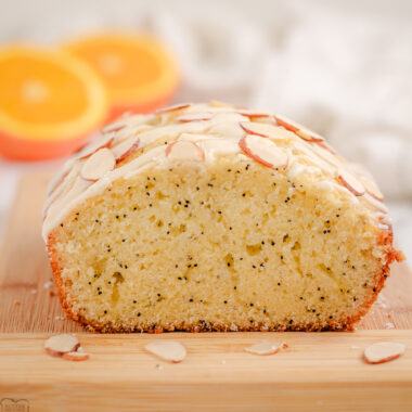 glazed poppy seed loaf bread cut in half