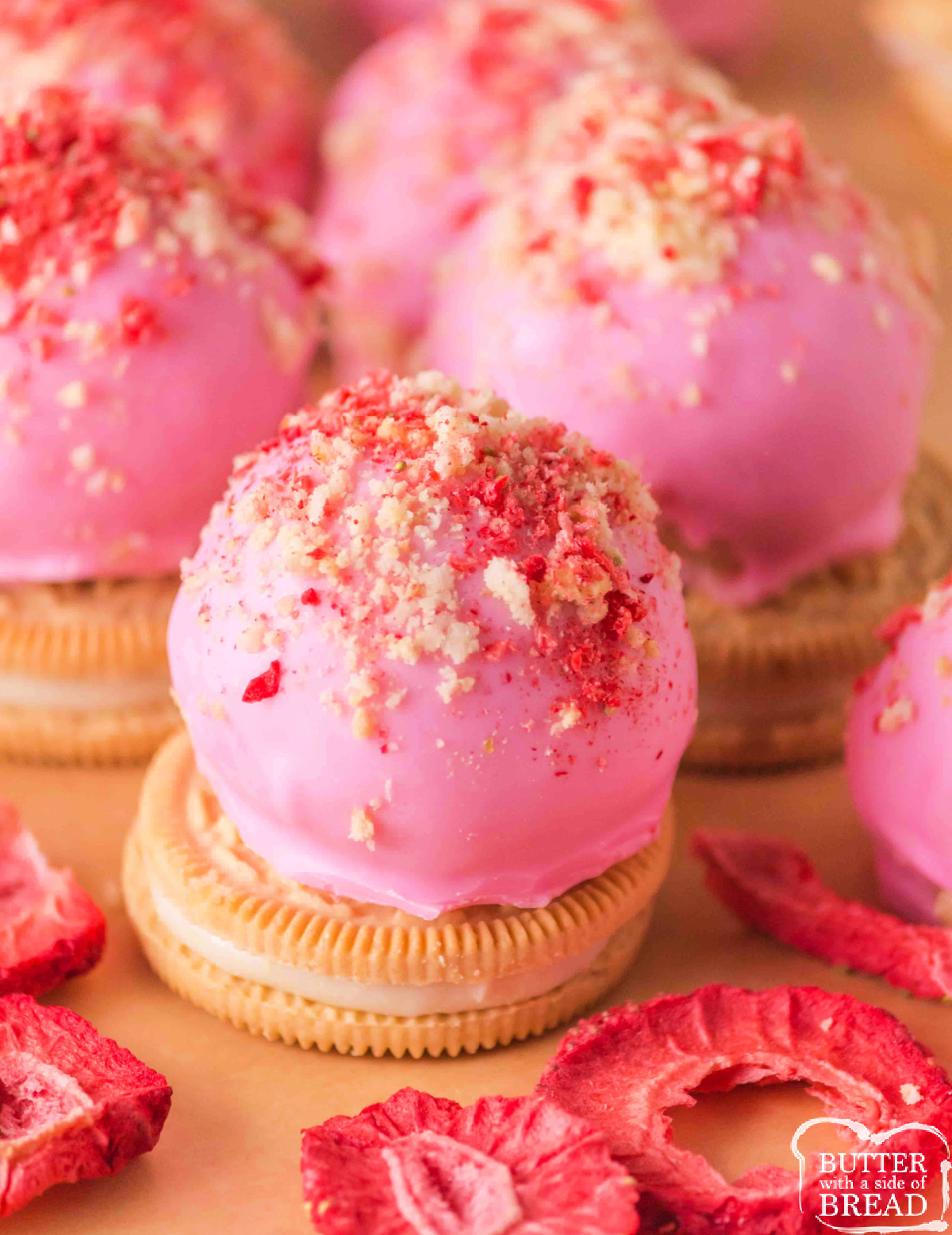 Strawberry cheesecake truffles topped with freeze-dried strawberries.