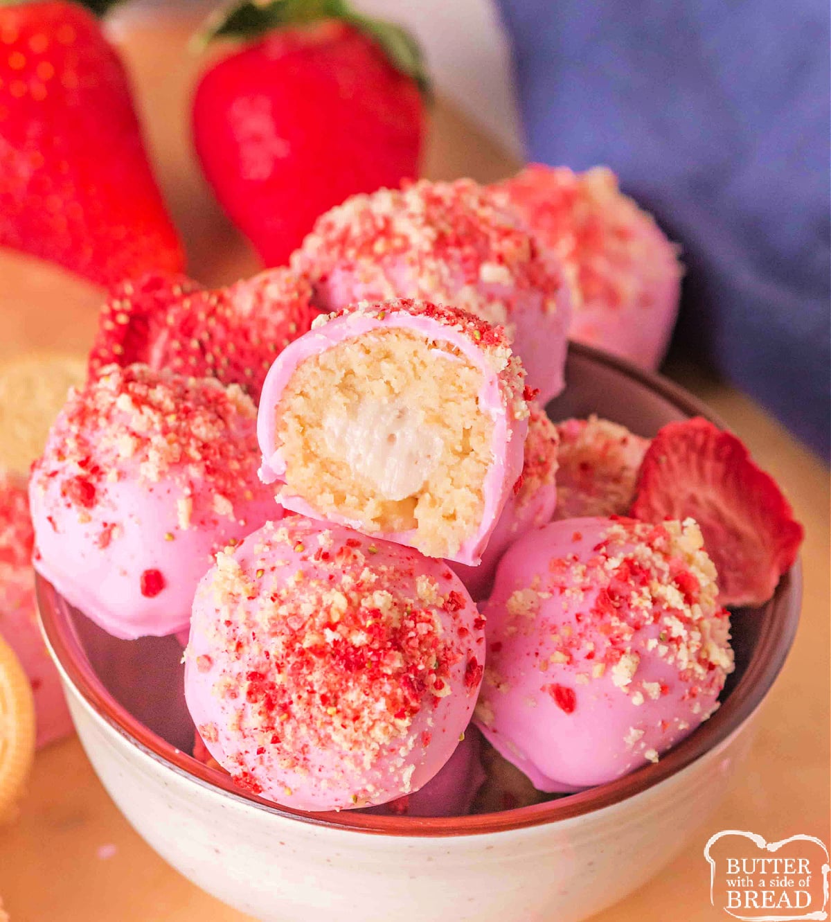 Strawberry cheesecake truffles coated in pink white chocolate.