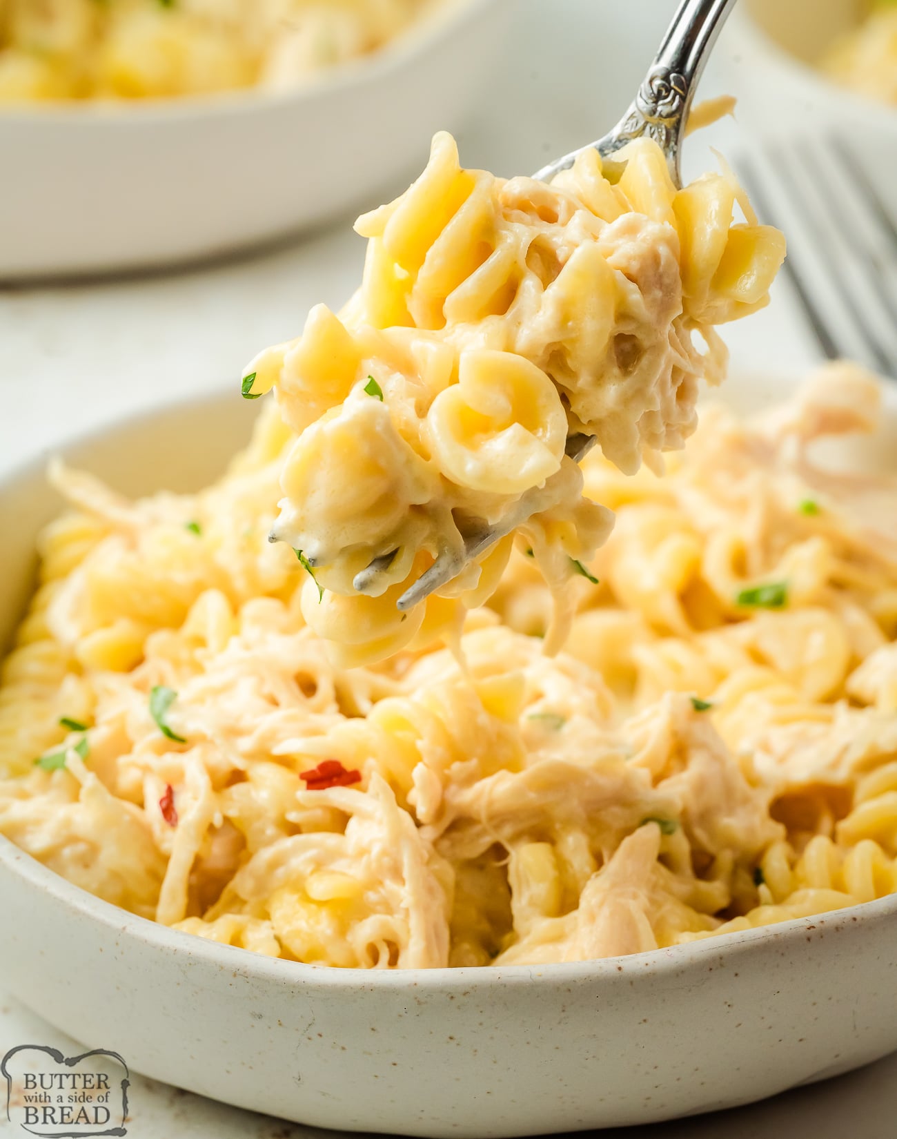bite of Italian chicken pasta on a fork
