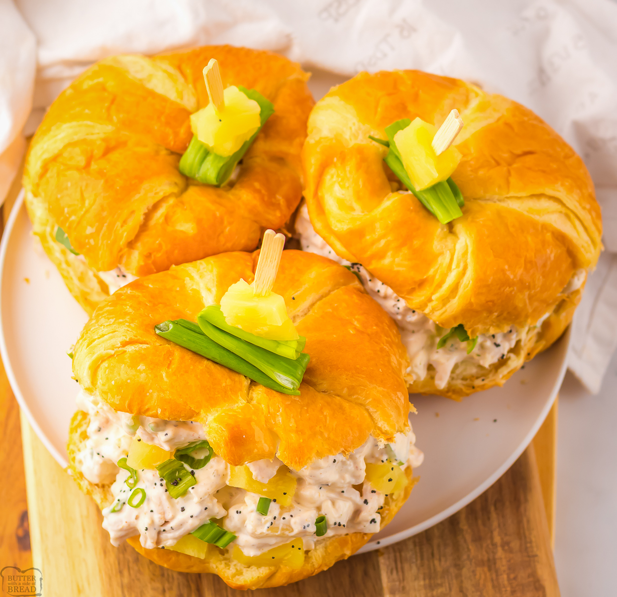 three croissants with hawaiian chicken salad with pineapple