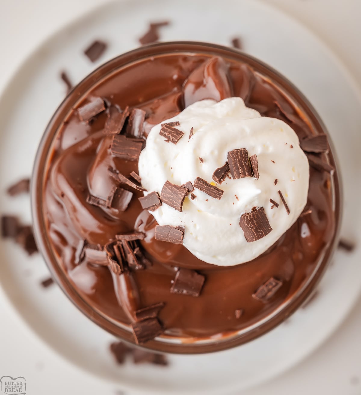 rich chocolate pudding in a bowl with chocolate curls