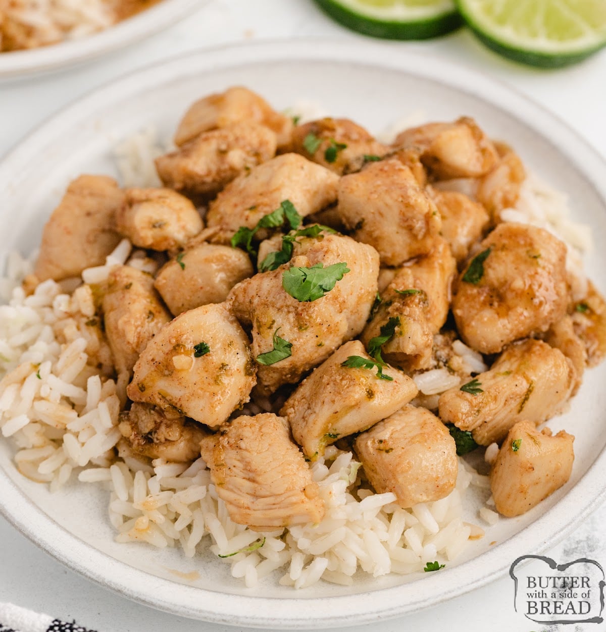 Honey lime chicken skillet served over white rice with fresh cilantro and lime wedges.
