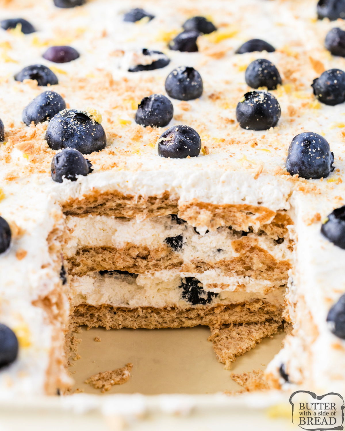 Served cold from a 9x13 dish, this Summer Lemon Blueberry Icebox Cake features fresh blueberries and bright lemon whipped cream.