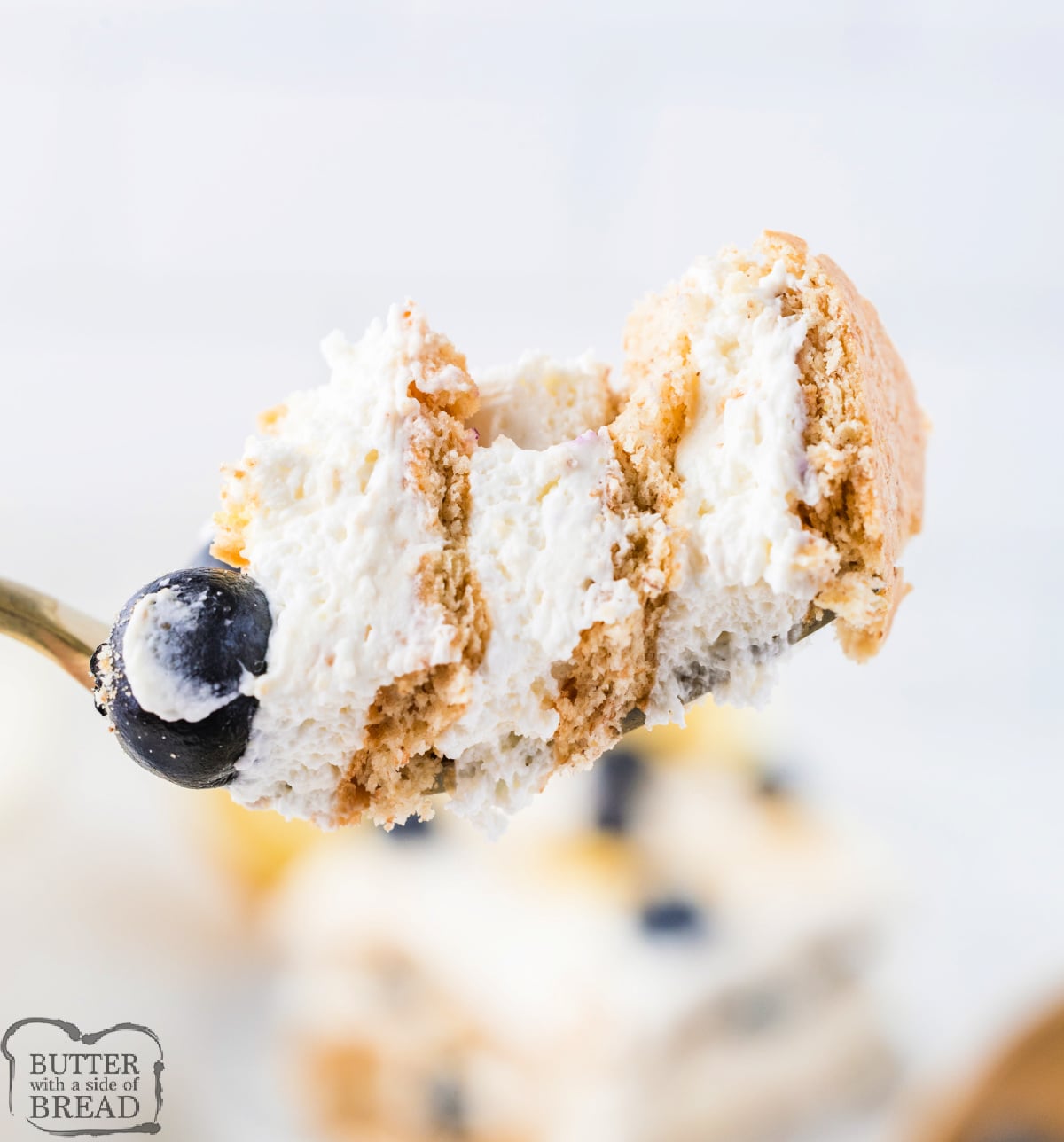 Lemon Blueberry Icebox Cake is an easy no-bake summer dessert with layers of lemon whipped cream, fresh blueberries, and softened honey graham crackers served straight from the baking dish.