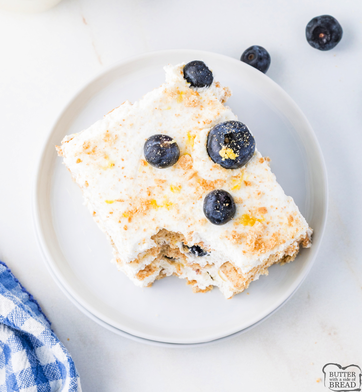 Honey graham crackers, lemon cream, and fresh blueberries topped with crushed crumbs make up every layer of this Lemon Blueberry Icebox Cake.