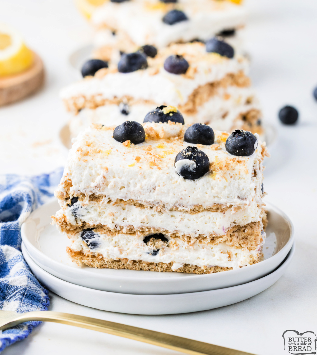 Honey graham crackers, lemon cream, and fresh blueberries topped with crushed crumbs make up every layer of this Lemon Blueberry Icebox Cake.