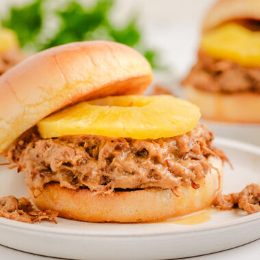 Slow Cooker Teriyaki Pulled Pork served on a bun with pineapple