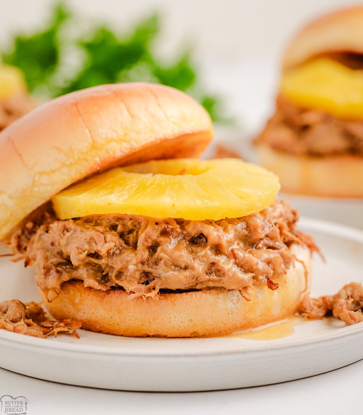Slow Cooker Teriyaki Pulled Pork served on a bun with pineapple