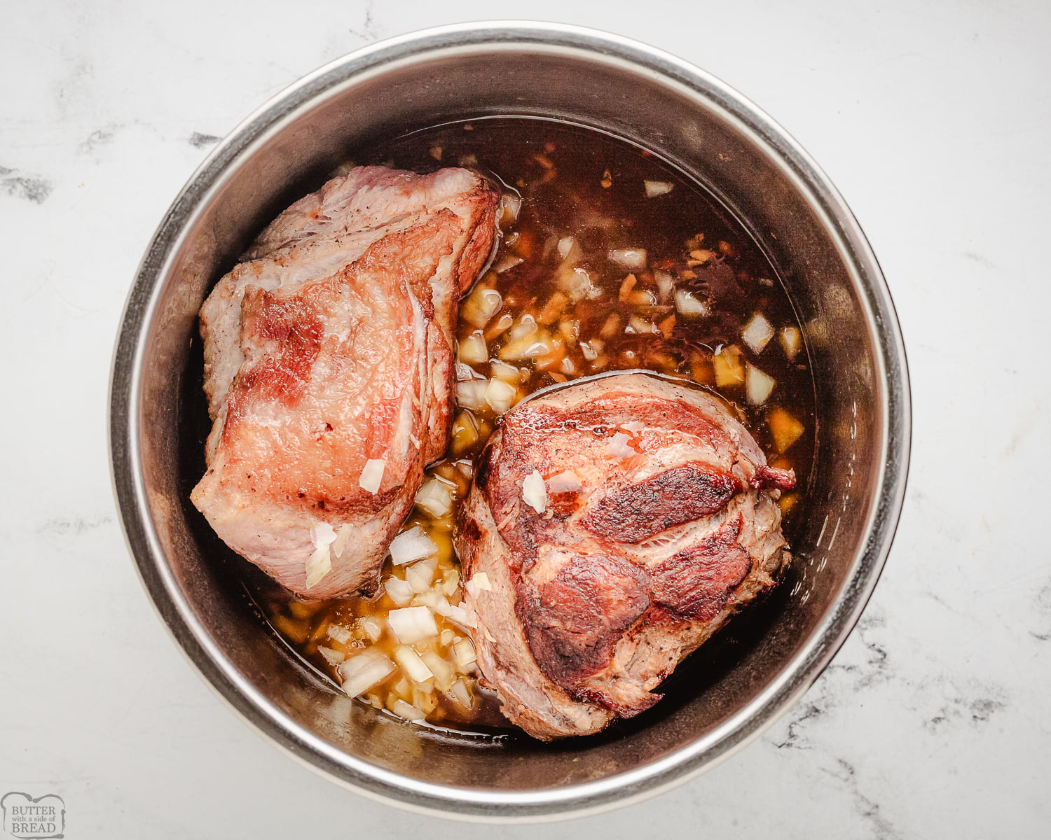 pork shoulder roast cooking with onion and teriyaki sauce