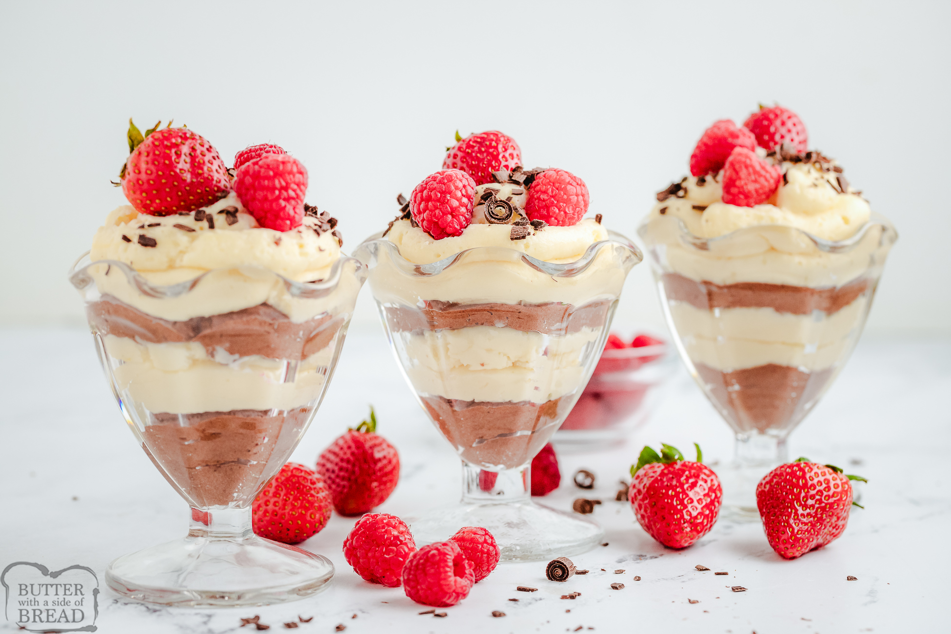 homemade mousse cups with layers of white chocolate mousse and semi sweet chocolate mousse