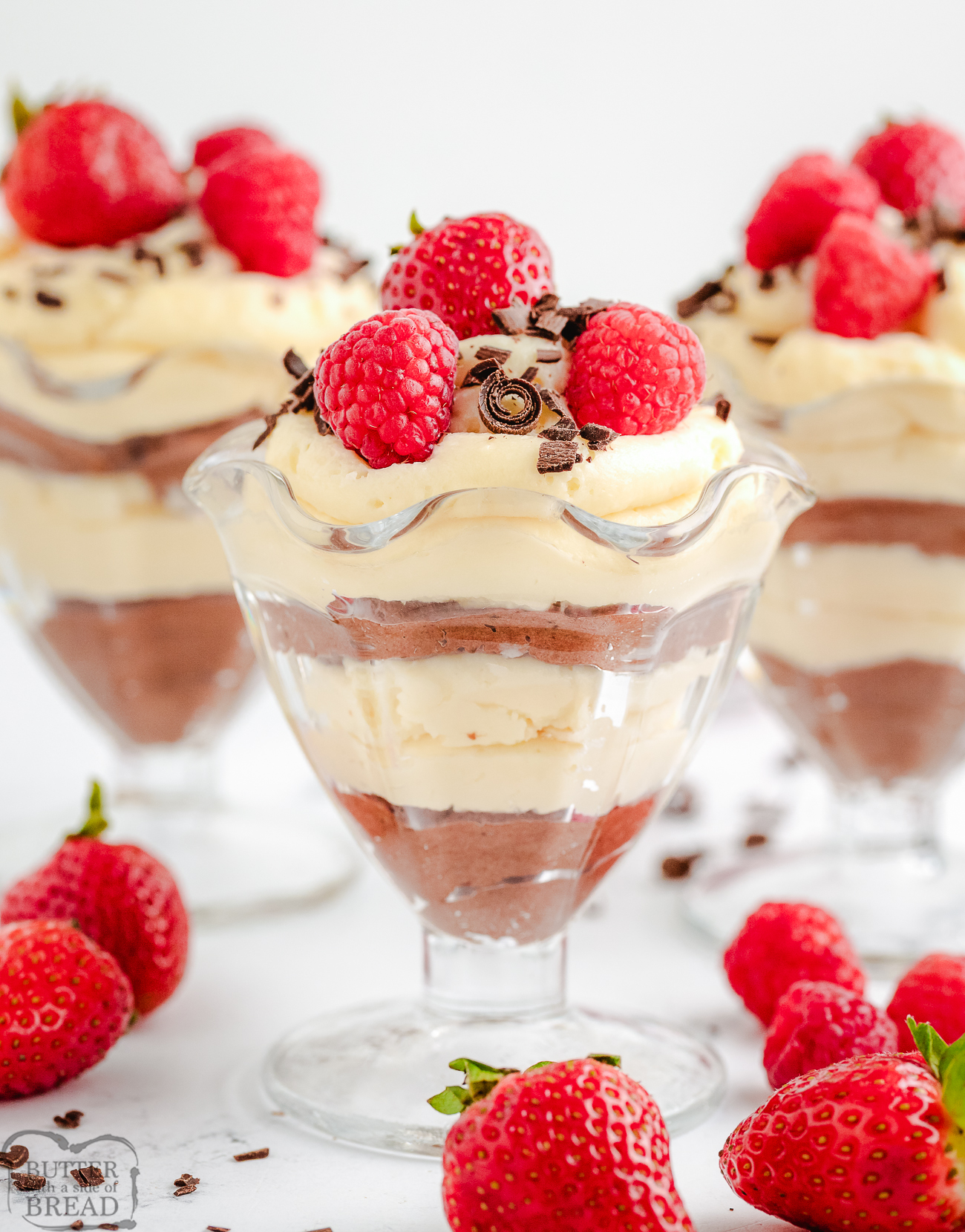 layered chocolate mousse cups topped with fresh berries