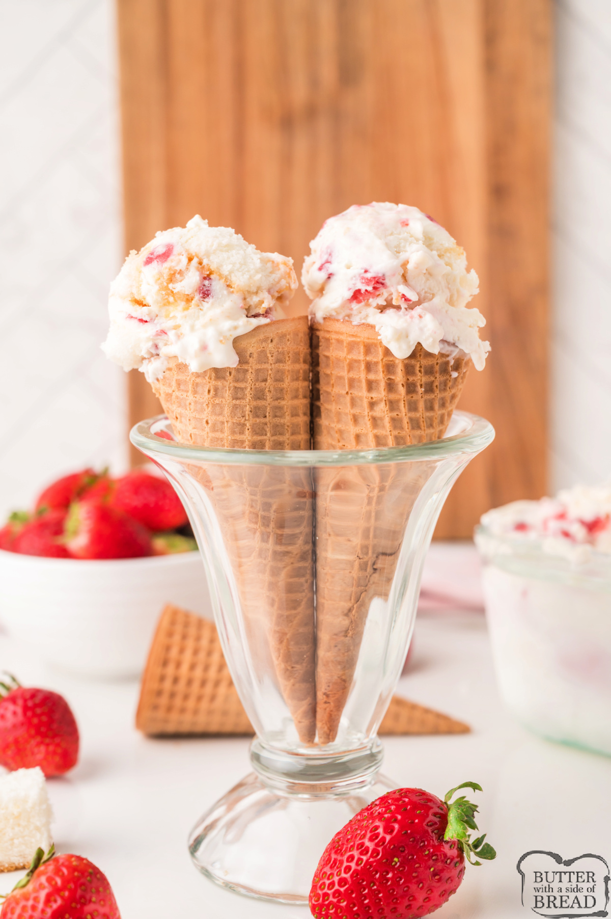 Easy no-churn strawberry ice cream with soft angel food cake and fresh strawberry ribbons.