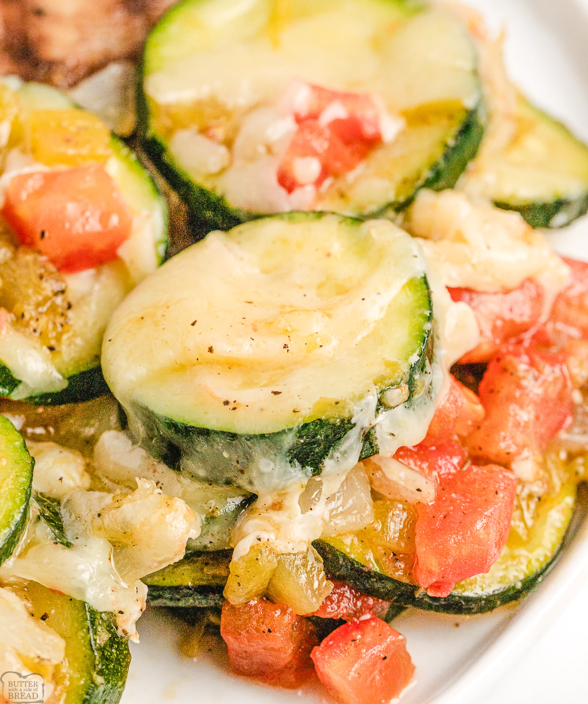 skillet zucchini and green chile side dish topped with monterey jack cheese
