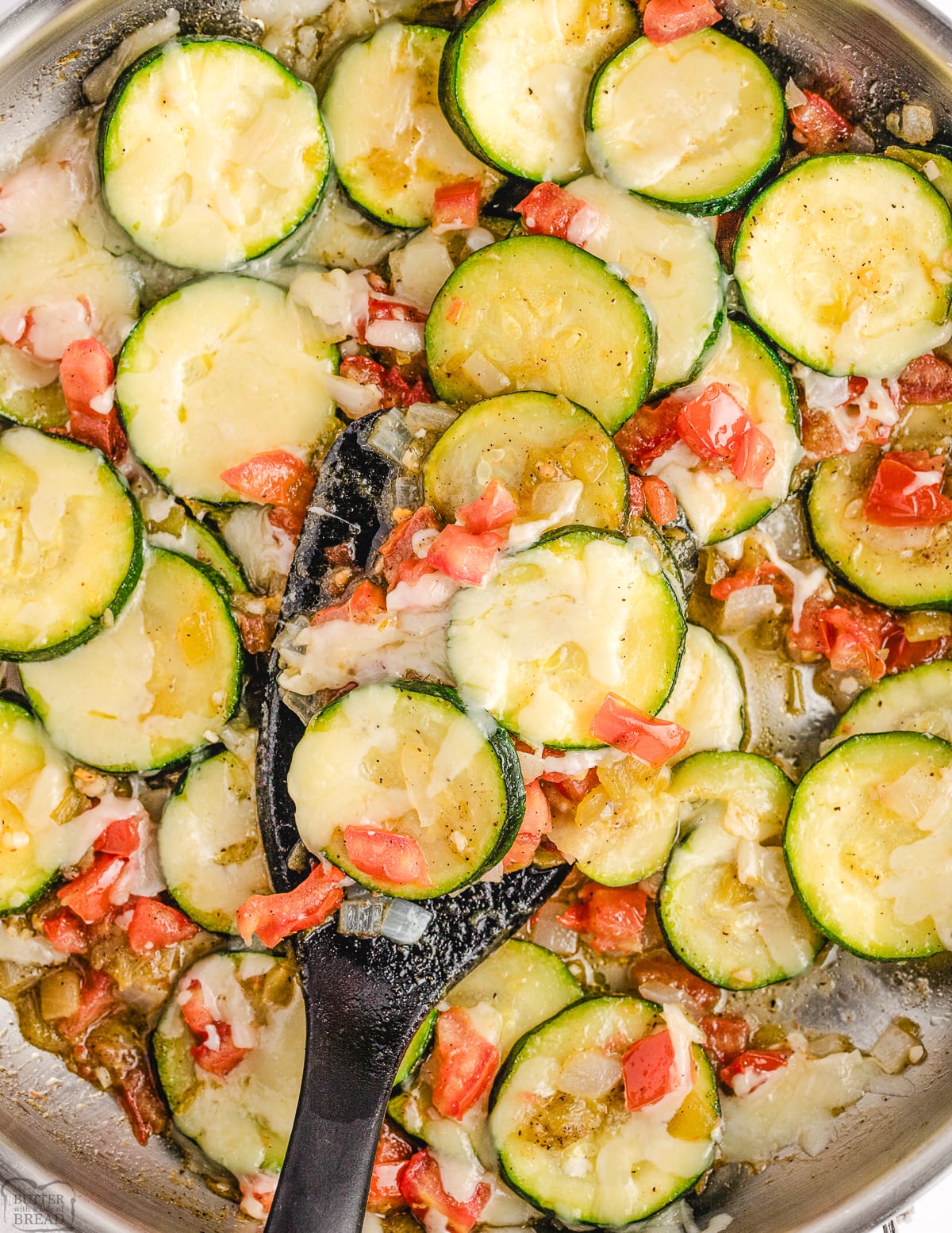 scooping out some skillet zucchini and green chile side dish