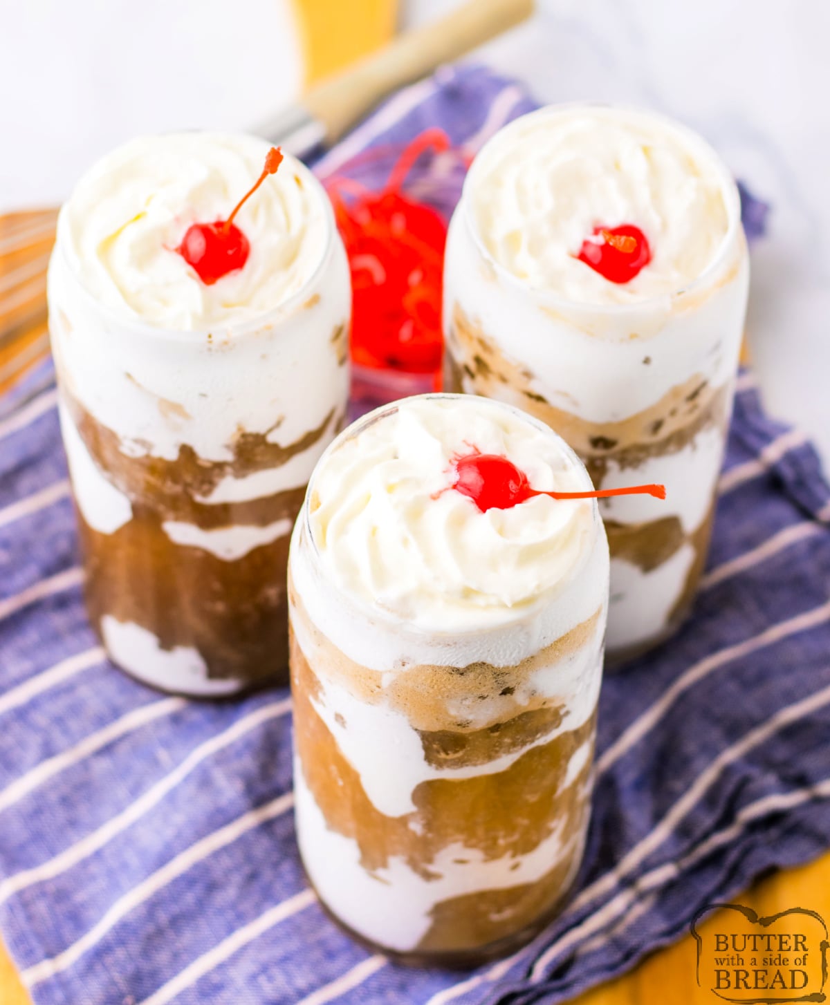 Easy viral Fluffy Coke recipe made with marshmallow fluff, soda, whipped cream and a maraschino cherry