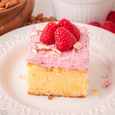 slice of Raspberry Almond sheet cake on a white plate